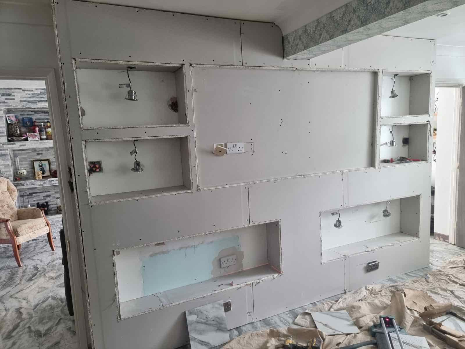 Stud-framed alcove shelving and fireplace recess before plastering and tiling